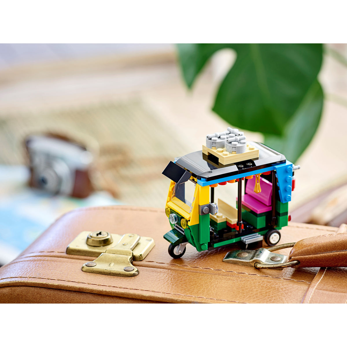 LEGO Creator 40469 Tuk Tuk displayed on a suitcase