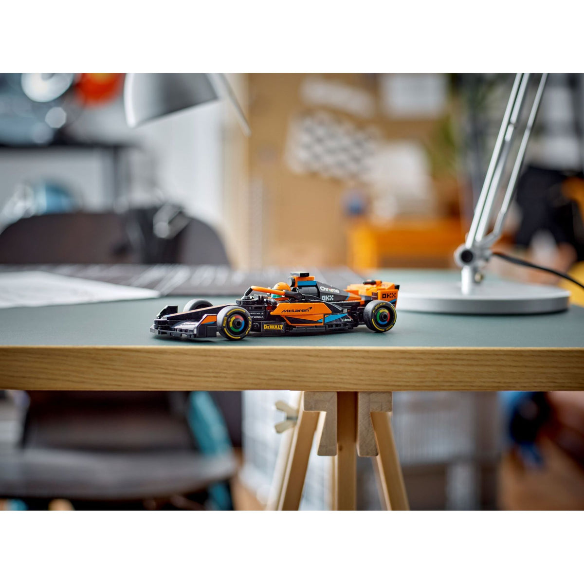 LEGO Speed Champions 76919 2023 McLaren Formula 1 Car displayed on a desk